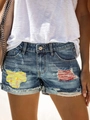 Pantaloncini denim da donna a vita media con strappi e fodera con motivi colorati - S / Blu