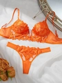 Macro detail of vibrant orange floral lace embroidery on sheer mesh plunge lingerie set - S / Orange