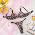 Detail view of leopard print lingerie set with mesh fabric and stylish cross straps - S / Leopard Embroidery Mesh Set
