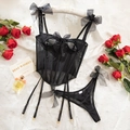 Gros plan d'une lingerie corset en mesh noir avec nœuds et porte-jarretelles réglables - S / Noir