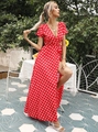 Close-up of red polka dot wrap dress with V-neck, short sleeves and waist tie detail - S / Red