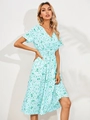 Detail shot of the V-neck and short sleeves on a floral light blue summer midi dress - S / Light Green