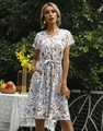 Detailed view of floral print dress featuring V-neck buttons and a waist tie-up bow - S / White Blue Baroque