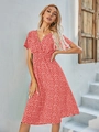 Detail of red floral dress featuring a deep V-neck and elastic high waist design - S / Red