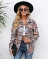 Detail view of the orange plaid shacket featuring double chest pockets and classic buttons - S / Orange Plaid