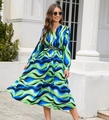Detail of V-neck long sleeve midi dress with wave print and pleated skirt and waist belt - Navy Blue