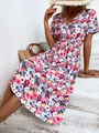 Close-up of floral V-neck dress with elastic waist and vibrant summer flower patterns - S / Pink