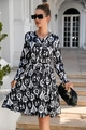 Close-up of black and white abstract print dress with V-neckline and button details - Black & White Ethnic
