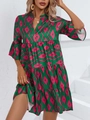 Close-up of the green and pink geometric print tiered skirt with ruffled hem details - S / Green Geometric Print (10996)