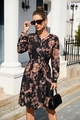 Detailed macro view of baroque print featuring golden chains and coins on a black dress - S / Black Baroque