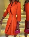 Detail of waist metal buckle and pleated hem on an orange V-neck wrap dress - Orange Style (5037 Orange)