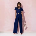 Elegante tuta blu scuro con scollo a V e cintura con fibbia dorata per la donna - S / Blu navy