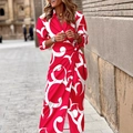 Lange damesjurk met rood-witte geometrische print en strikceintuur in de taille - S / Rood Wit Paisley Print