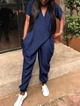 Outdoor shot of loose-fitting navy blue short sleeve jumpsuit with deep V-neck and tied waist - XL / Navy Blue