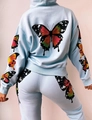 Detail view of colorful butterfly prints on back of light blue hoodie and jogger set - S / Top And Bottom / Sky Blue