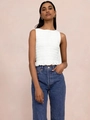 Detail of white smocked sleeveless top with ruffled hem and textured elastic fabric - S / White