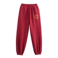 Dettaglio dei pantaloni sportivi bordeaux con elastico in vita e stampa Oakland - XS / Pants / Borgogna