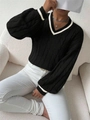 Detail view of black V-neck cable knit sweater with white contrast stripes on neckline - S / Black