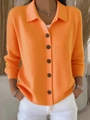 Detail of orange knit cardigan showing the polo collar, texture, and dark brown buttons - Orange Red