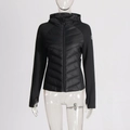 Close-up of women's hooded jacket featuring hybrid quilted panels and thumbhole cuffs - Black