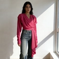 Detail of magenta V-neck wrap top with dramatic floor-length fringe hanging from waist - One Size / Pink
