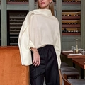 Detail of beige satin shirt featuring asymmetric drape neck and split cuff design - S / Apricot