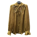 Elegante gouden blouse met lange mouwen, lovertjes en strikhals van geplooide stof - M / Goud