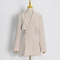 Detail view of beige cut-out waist blazer jacket with notched lapel and long sleeves - XS / Apricot