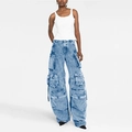 Detailed view of women's multi-pocket cargo pants in vintage washed blue denim fabric - Blue