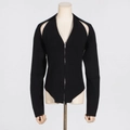 Detail of black ribbed knit top showing front zipper closure and cutout shoulder design - L / Tops / Black
