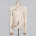 Close-up of asymmetrical off-white blazer featuring a gold shell brooch and geometric hem - S / Apricot