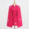 Detail of rose pink suit with sequined floral appliques and a waist-cinching bow belt - Rose Red