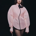 Detail of pink sheer puff sleeve shirt with a large black contrast bow and edging - Pink