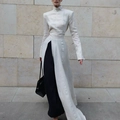 Close-up of elegant cream high-neck dress featuring high side slits and cotton-linen texture - S / Off-white