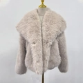 Close-up of fluffy faux fur texture and wide collar on light pink short coat - Gray