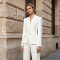 Detailed close-up of ivory white blazer with double-breasted buttons and matching waist belt - S / White