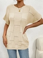 Close-up of beige knit top featuring vintage hollow check pattern and round neckline - Light Khaki