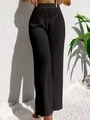 Dettaglio ravvicinato della trama a maglia nera a vita alta di questi pantaloni da spiaggia - S / Nero