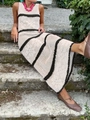 Detail of crochet knit maxi dress with black stripes and hollow out texture on beige fabric - White