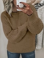 Close-up of brown chunky knit sweater with puff sleeves and crew neck design - Khaki