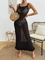 Detail of black crochet knit long dress featuring hollow-out pattern and wavy hemline - S / Black