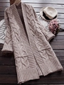 Chunky knit cable cardigan for women in oatmeal beige with large pockets on wood background - S / Tan