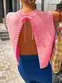 Detail of pink knitted backless vest featuring textured fabric and a neck tie-back design - S / Pink