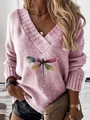 Detail of V-neck pink knit sweater featuring artistic dragonfly print and let it be text - S / Pink