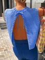 Macro detail of sky blue knit top showing backless design with neck tie knot - Sapphire Blue