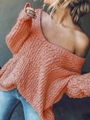 Detalle de jersey de punto calado naranja con textura de punto grueso y cuello de pico - Naranja Rosado