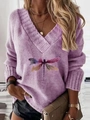 Close-up of lavender V-neck knit sweater featuring colorful dragonfly print and text - Light Purple