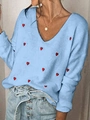 Detail of soft light blue knit sweater featuring red heart embroidery and classic V-neck design - S / Light Blue