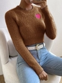 Detail showing plush brown knit sweater texture and pink heart patch with long sleeves - Coffee