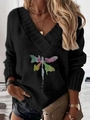 Detail of V-neck black knit sweater featuring colorful dragonfly and Let It Be text - Black